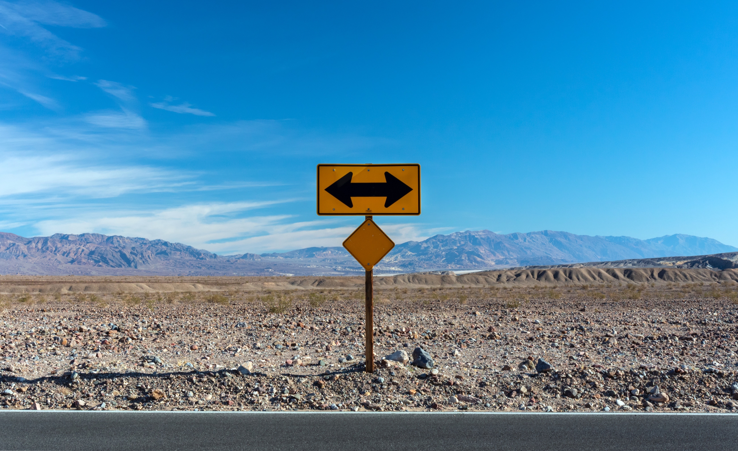 Overlapping road signs viewed from above illustrating the complexity of the different sustainability reporting standards